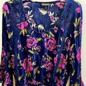 A beautiful floral blue and pink with bell sleeves